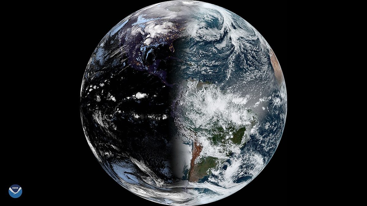 Satellite view of Earth from NOAA's GOES-East, with the night side on the left and sunlit clouds and land on the right.